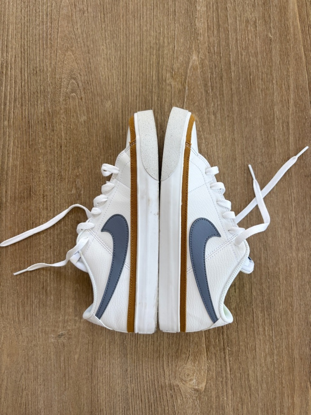 NIKE Women’s White Sneakers with Grayish-Blue Swoosh and Tan Trim
